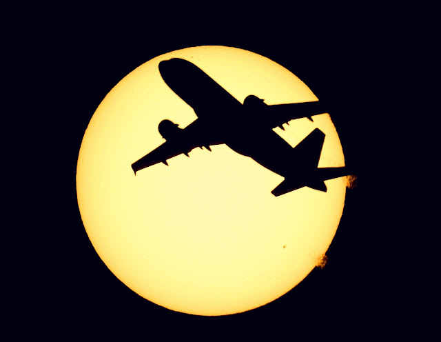 Airbus A319 Silhouette Behind Sun Scene