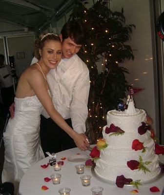 Yes that is a Boston Red Sox Bride and NY Jets Wedding Cake Topper