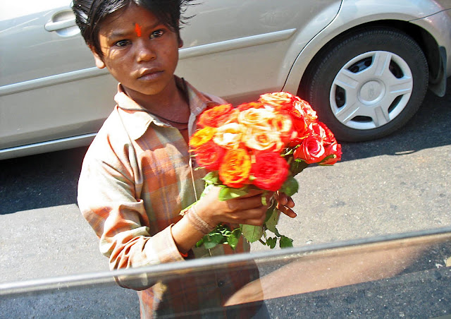 boy selling flowers