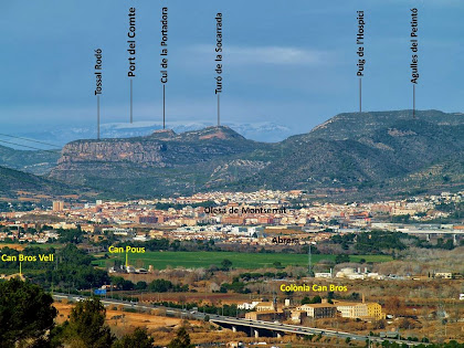 Panoràmica, vers el nord-oest, d'Olesa de Montserrat amb les muntanyes del Tossal Rodó, el Cul de la Portadora, el Turó de la Socarrada i el Puig de l'Hospici