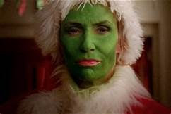 Sue dressed like the Grinch (green face paint and all)