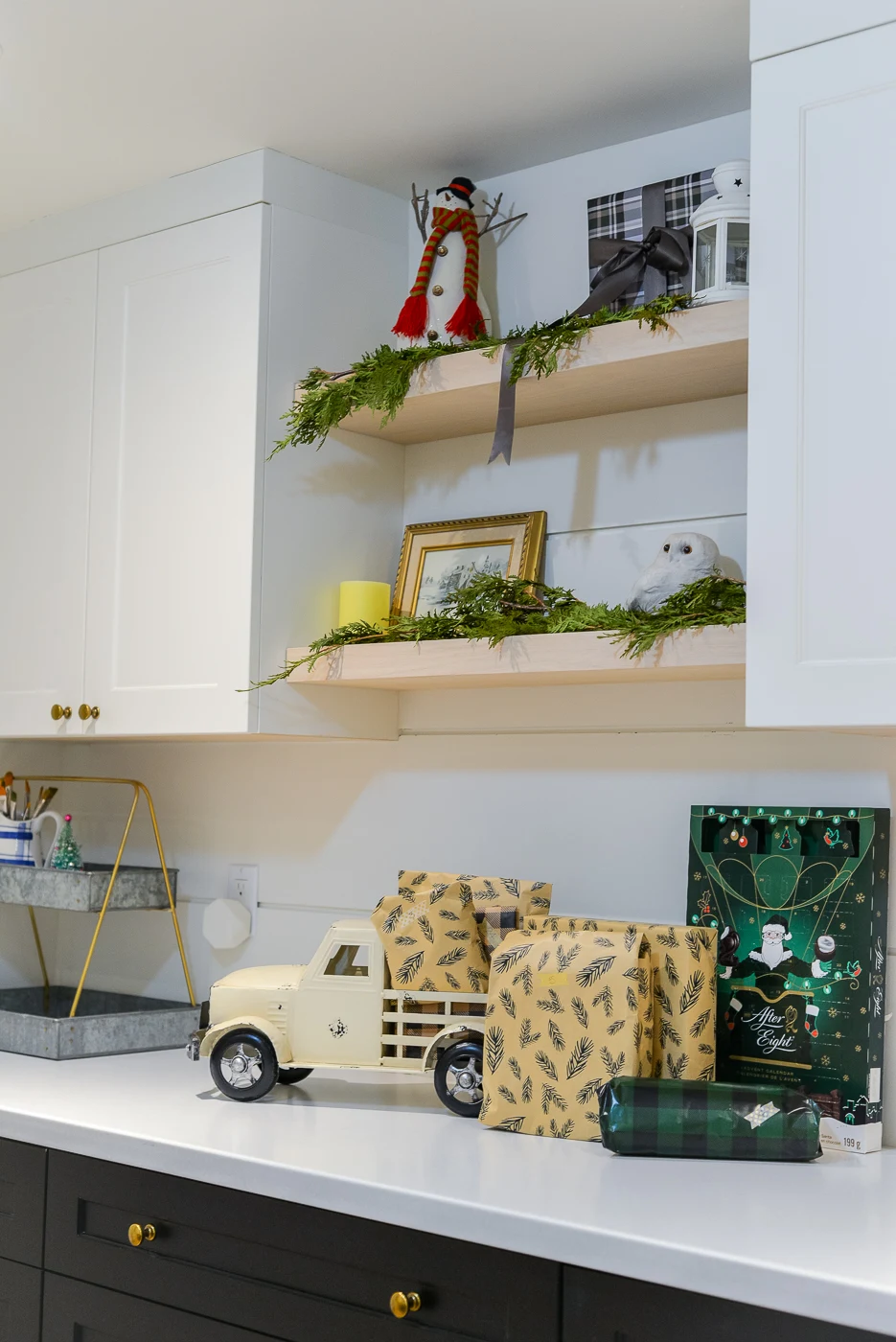small metal truck with wrapped gifts and floating shelves