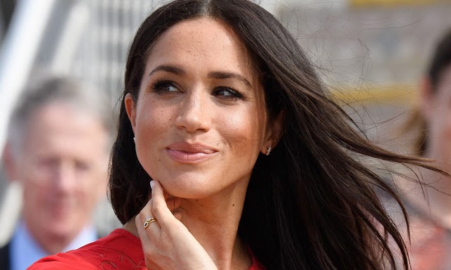 Meghan Markle surprises in mini dress and red lipstick on Easter Sunday.