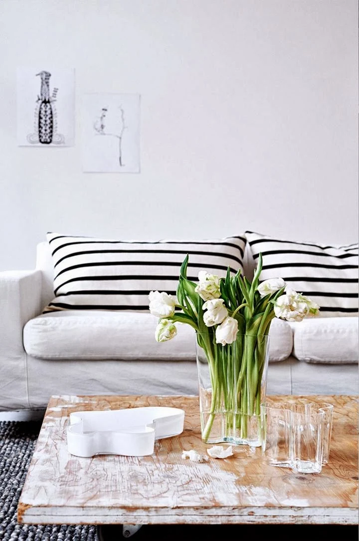 Black and white striped cushions and neutral interior design