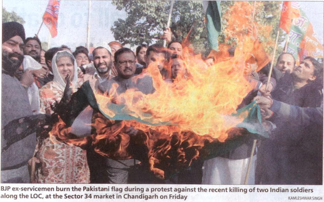 BJP leader Satya Pal Jain and BJP ex-servicemen burn the Pakistani flag during a protest against the recent killing of two Indian soldiers along the LOC, at the Sector 34 market in Chandigarh on Friday.