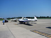 Neil preflighting his Mooney. Mike leading Ranger over to the 172