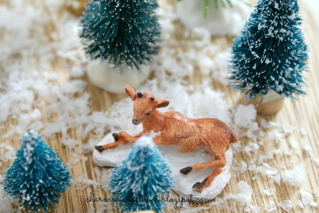 mini resting reindeer bottle brush trees faux snow