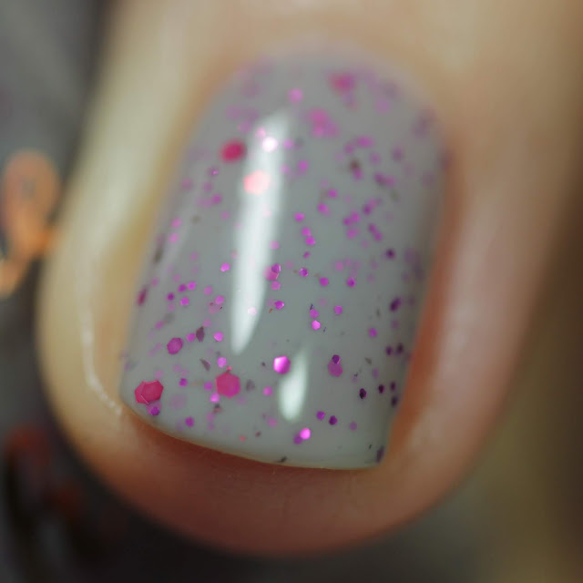 nail polish with Grey base with berry pink glitters