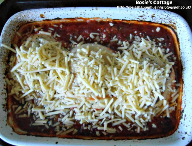 Scatter grated cheese over the chicken fillets and return them to the oven.