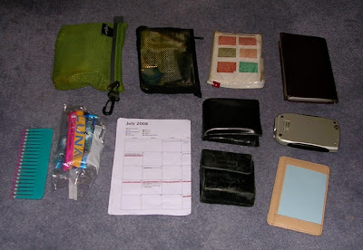 purse contents laid out on floor