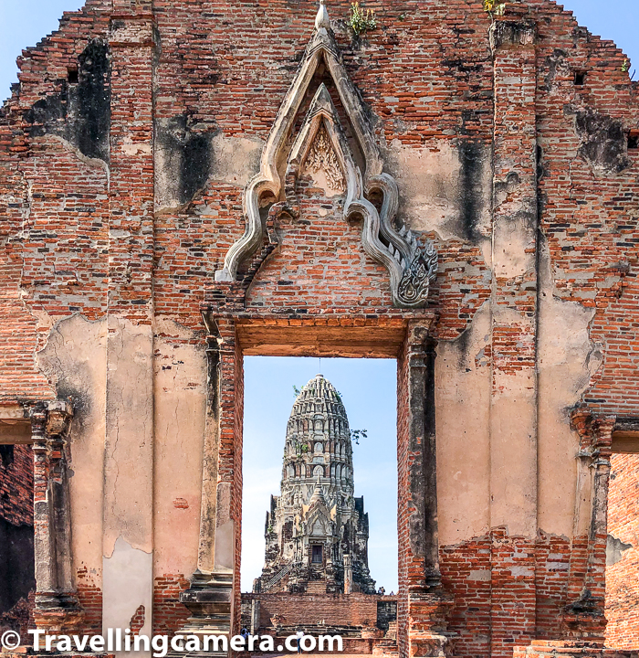 Wat Ratchaburana is a Buddhist temple/wat in the Ayutthaya, Thailand. The temple's main prang is one of the finest in Ayutthaya city. Located in the island section of Ayutthaya, Wat Ratchaburana is immediately north of Wat Mahathat. This part of Ayutthaya is also called Ayutthaya Historical Park and you would notice a very different kind of vibe while roaming around few acres of this region, which is full of all these temples.     Center part of Wat Ratcha Burana in Ayutthaya is a large Khmer style prang symbolizing Mount Meru, the center of the universe in Buddhist and Hindu cosmology. The prang is surrounded by four smaller towers, in turn surrounded by a gallery enclosing a courtyard. I remember it was very hot day when we were in Ayutthaya and lot of these structures all around the temple complex were very helpful in providing us shadow to walk around.
