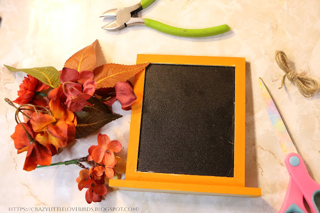 faux floral, floral cutter, and scissors on a table