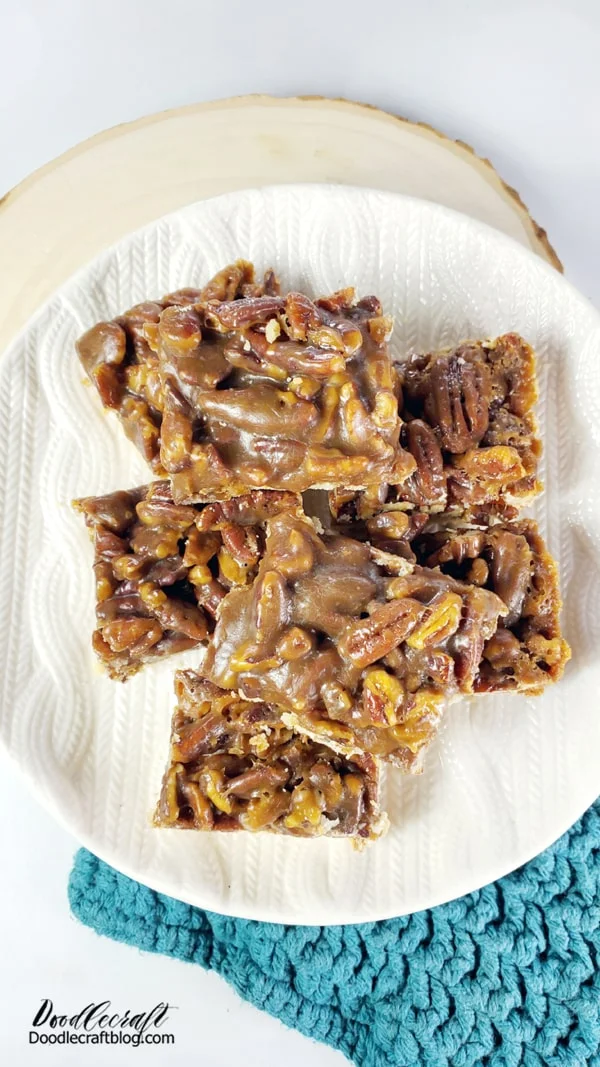 Pecan Bar Recipe:  Ingredients:  Shortbread Crust Base: 2 Cups Flour 1/2 Cup Sugar 1/4 tsp Salt 3/4 Cup Butter (cold and cut into small pieces)  Pecan Topping: 3/4 Cup Dark Brown Sugar 1/2 Cup Dark Brown Karo Syrup (no high fructose corn syrup) 3/4 Cup Butter 1/4 Cup Heavy Cream 1/4 tsp Salt 1 Tbsp Vanilla 3 1/2 Cups chopped Pecans  Directions: Preheat oven to 350*F Line a 9x13 baking dish with foil or parchment paper.  Mix the shortbread crust ingredients together and pulse in a food processor until dusty. Pour the crumbs into a 9x13 pan lined with foil. Press the crumbs into the pan and the corners.  It's very dusty and doesn't make a batter or dough. It's just crumbs. (trust the process) Then bake in the oven 350* for 20 minutes.  While baking the crust, make the topping.  Combine the sugar, karo, butter, cream and salt in a saucepan and mix on medium heat until boiling. Then boil for 2 minutes. Remove from heat and add the vanilla and chopped pecans.  Pour the mixture over the top of the shortbread crust as soon as it comes out of the oven. I was ready to pour the topping on about 2 minutes before the timer went off.  Cover the crust with the topping and place back in the oven for 25 more minutes.  Remove from oven and let cool down completely.  If the baking dish is covered in foil, it's easy to just lift it right out onto a cutting board and cut into uniform bars.  They are even better the second day--if you can wait that long!