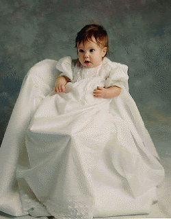 baby in christening gown