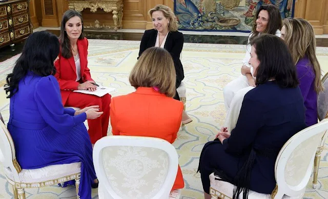 Queen Letizia wore a fuchsia, pink, red blazer suit by Carolina Herrera. Patrizia Pepe pumps, Gold and Rose earrings