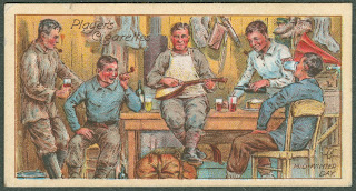 A card bearing an illustration of a group of men smoking, drinking, and playing music together.