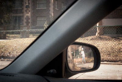 construction worker in car mirror