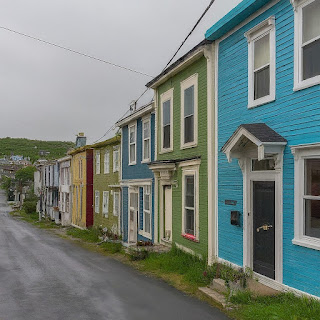 Experience the artistic charm of St. John's, Newfoundland, with its bright Jellybean Row houses and dynamic local art scene.