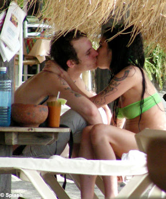 Amy Winehouse and her husband Blake Fielder-Civiland canoodled on a sunshine holiday on the Caribbean isle of St Lucia 