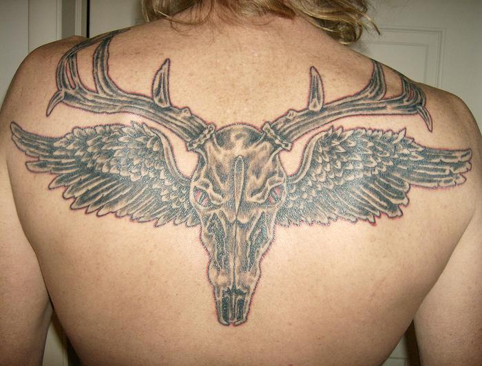 Deer Tattoos and Deer Tattoo Designs Skull with large antlers and angel 