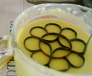 Dipping the Kuih Ros mould into batter