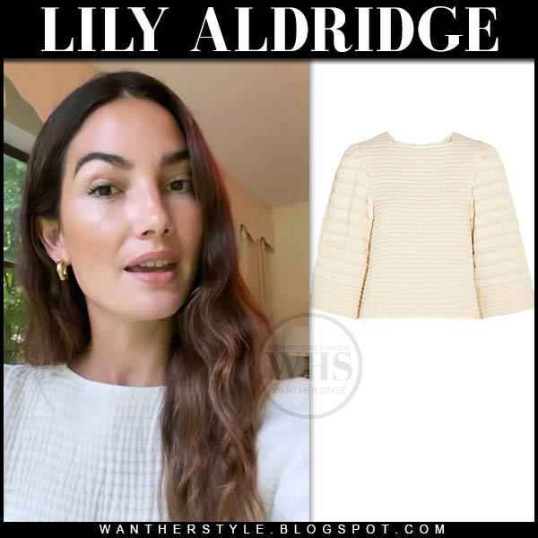 Lily Aldridge in white quilted top and gold earrings