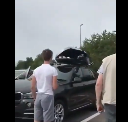 2 African Migrants hide in car roof rack of Tourist UK Family