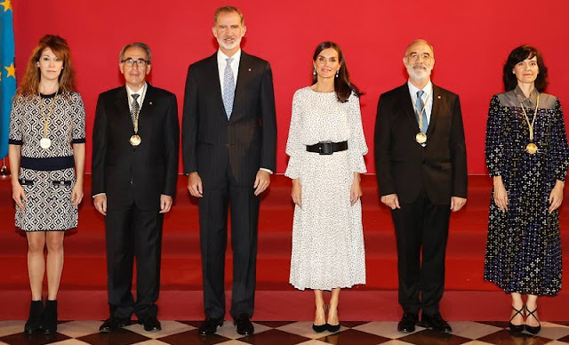 Queen Letizia wore a polka dot jacquard motif crepon long dress by Emporio Armani. Tous Jewelry pearl and diamond earrings