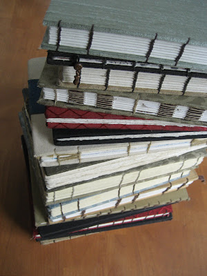 Erin Curry art- photograph of handbound sketchbooks