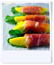 Prosciutto with mango and arugula