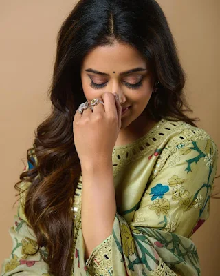 Priyamani smiling and laughing while wearing a casual outfit