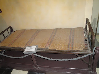 soldier's bed at Hanoi Hilton