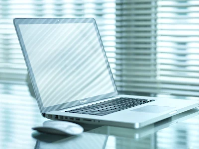 Grey Macbook Pro Laptop on Desk Lights HD Desktop Wallpaper