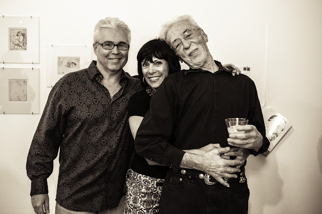 Theo Wujcik at Tempus art gallery with two fans