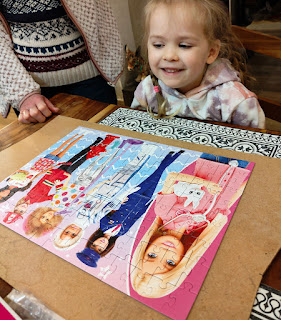 Rosie with her completed jigsaw puzzle