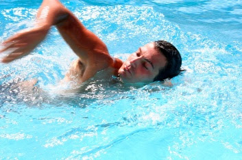 Picture of a male freestyle swimmer in a lane at the pool. Yes Is It Possible To Learn How To Swim Front Crawl (Freestyle)