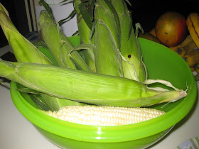 corn on the cob in its own jacket in a bowl