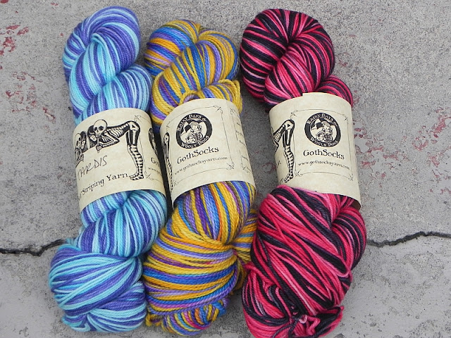 3 colourful skeins of yarn together