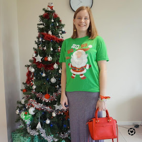 awayfromblue Instagram | casual Christmas eve outfit festive Santa glitter tee with gold bauble earrings and red rebecca minkoff bag