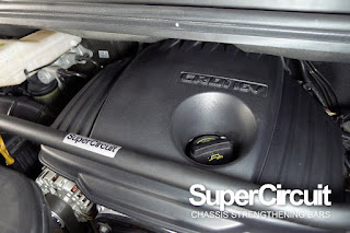 SUPERCIRCUIT FRONT STRUT BAR installed to the engine bay of the Hyundai Starex.