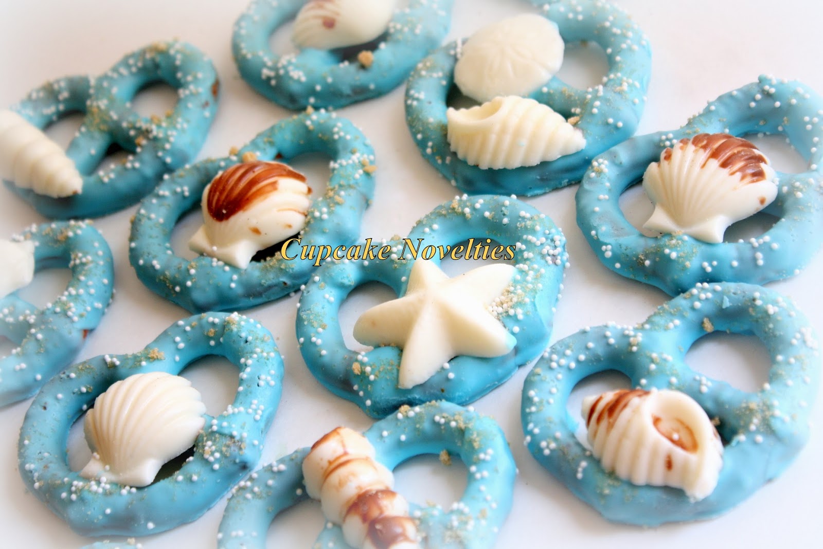 Cupcake Novelties Cakes Cupcakes Wedding Cakes Cake Pops Cookies Pie Pops In Fairfax Va Under The Sea Themed Seashell Topped Chocolate Dipped Pretzels Under The Sea Party Favors Cookies Dessert Table