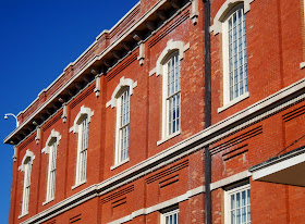 The Filter Building at White Rock Lake features exposed red brick walls & original iron trusses