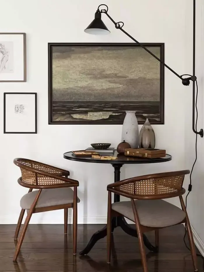 Small breakfast nook with art on wall