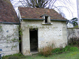 Hen house in a garden (formerly a dovecote).  Indre et Loire, France. Photographed by Susan Walter. Tour the Loire Valley with a classic car and a private guide.