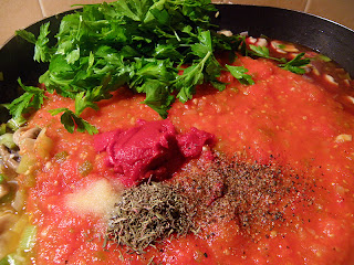 Sauce: adding tomato paste, thyme, oregano, parsley, salt and pepper