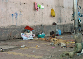 homeless child on pavement