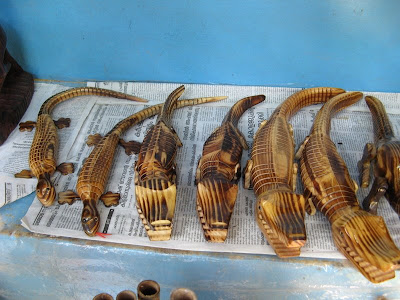 Wooden crocodiles on display near Pookot Lake, Wayanad