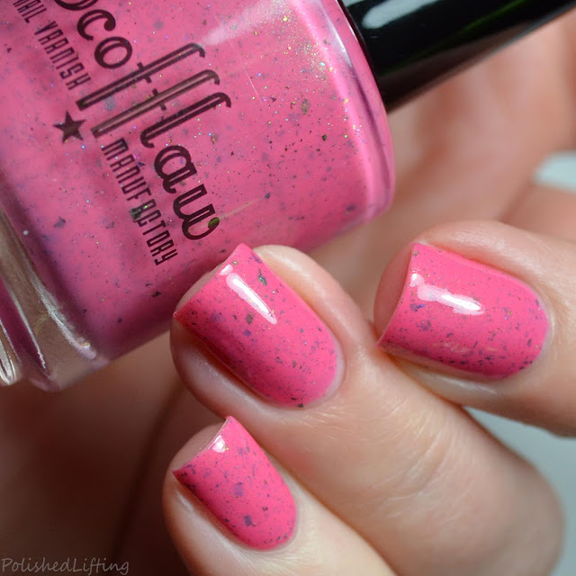 pink nail polish with flakies