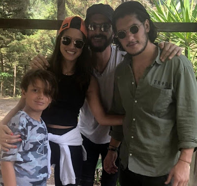 Adria Arjona with her father and brothers
