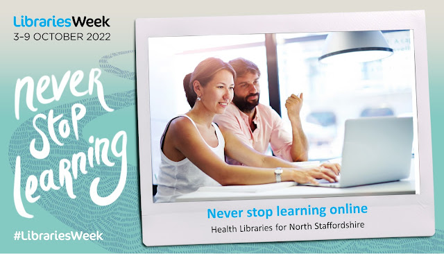 Man and woman working together on a laptop in the library